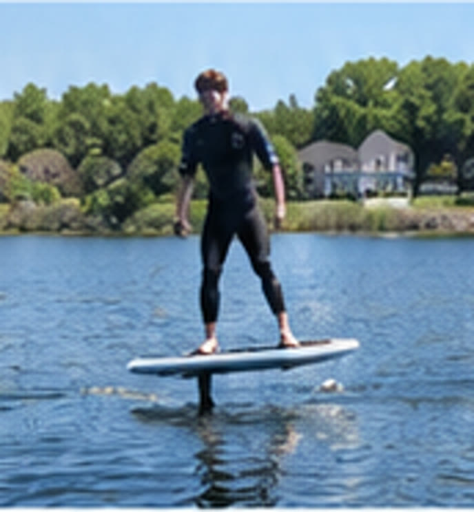 AFLOAT rider flying above flat water on an eFoil in Maine